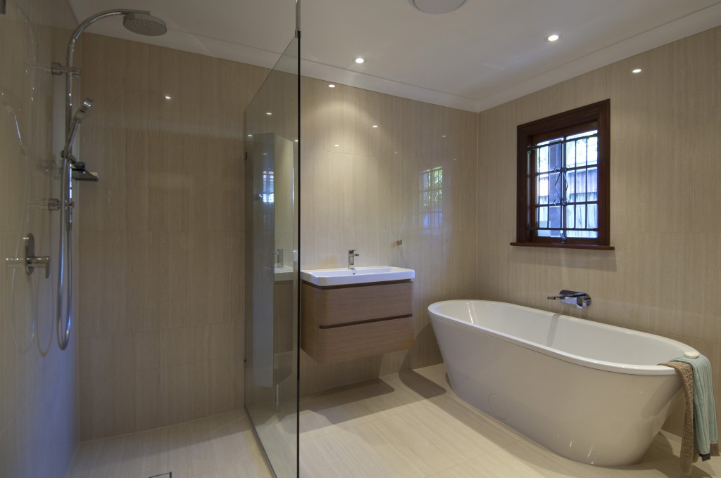 Timber window frame in bathroom, free standing bath, wall mounted bath spout